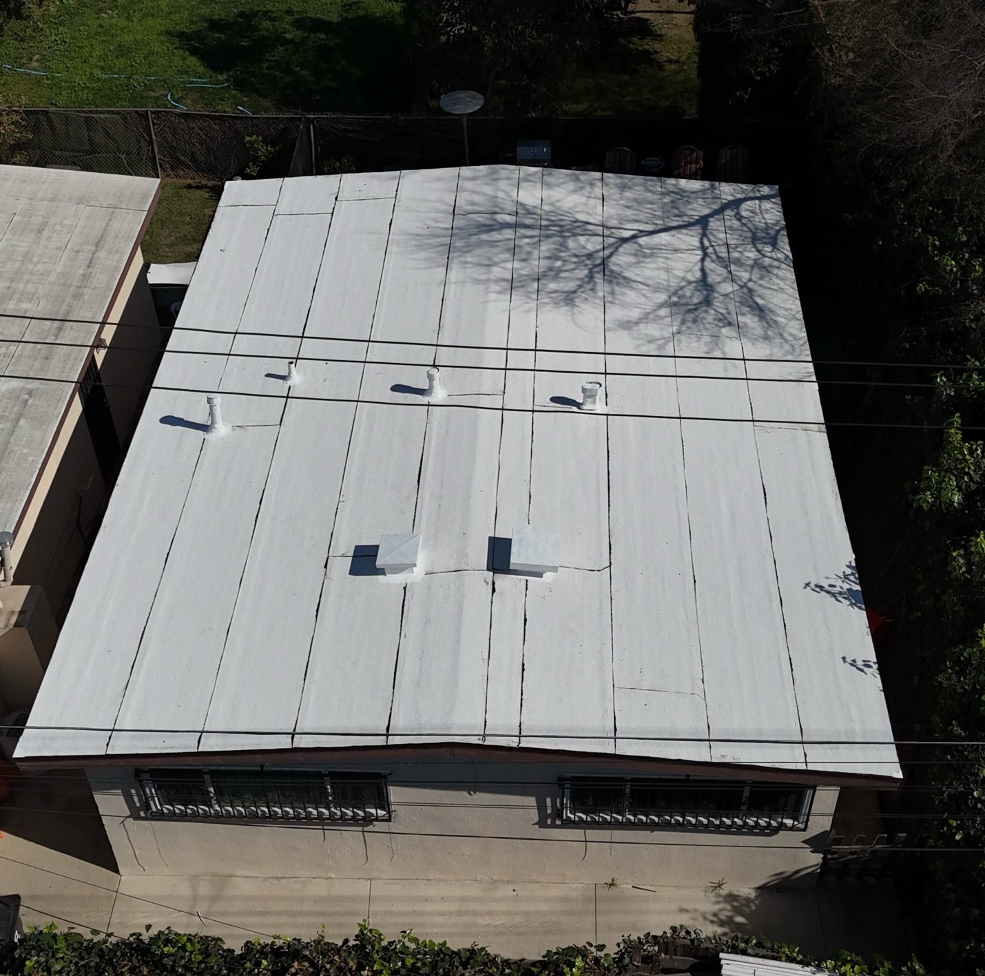 Aerial view of a flat torch roof replacement on a triplex in Compton