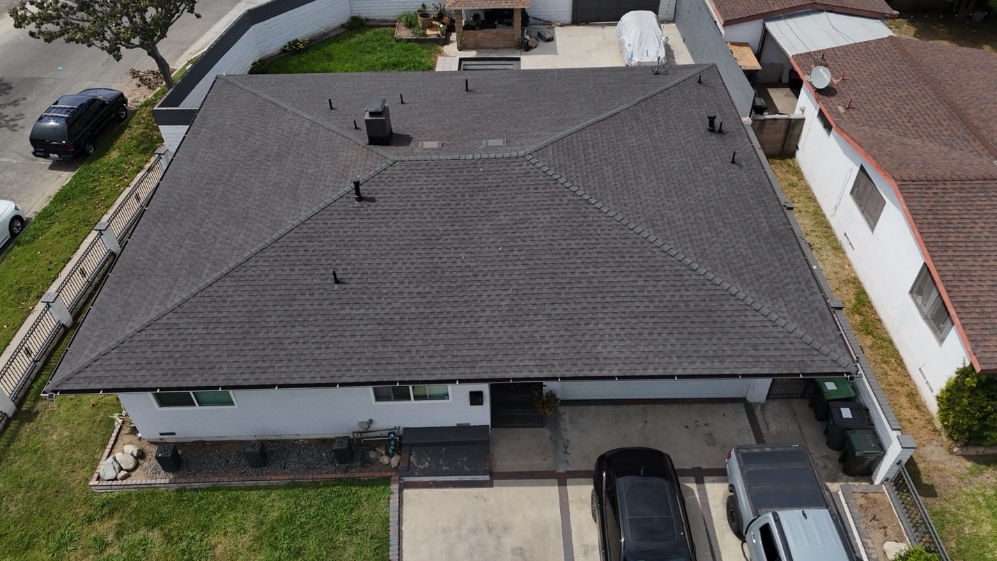 Aerial view of a shingle roof replacement on a home in Fullerton