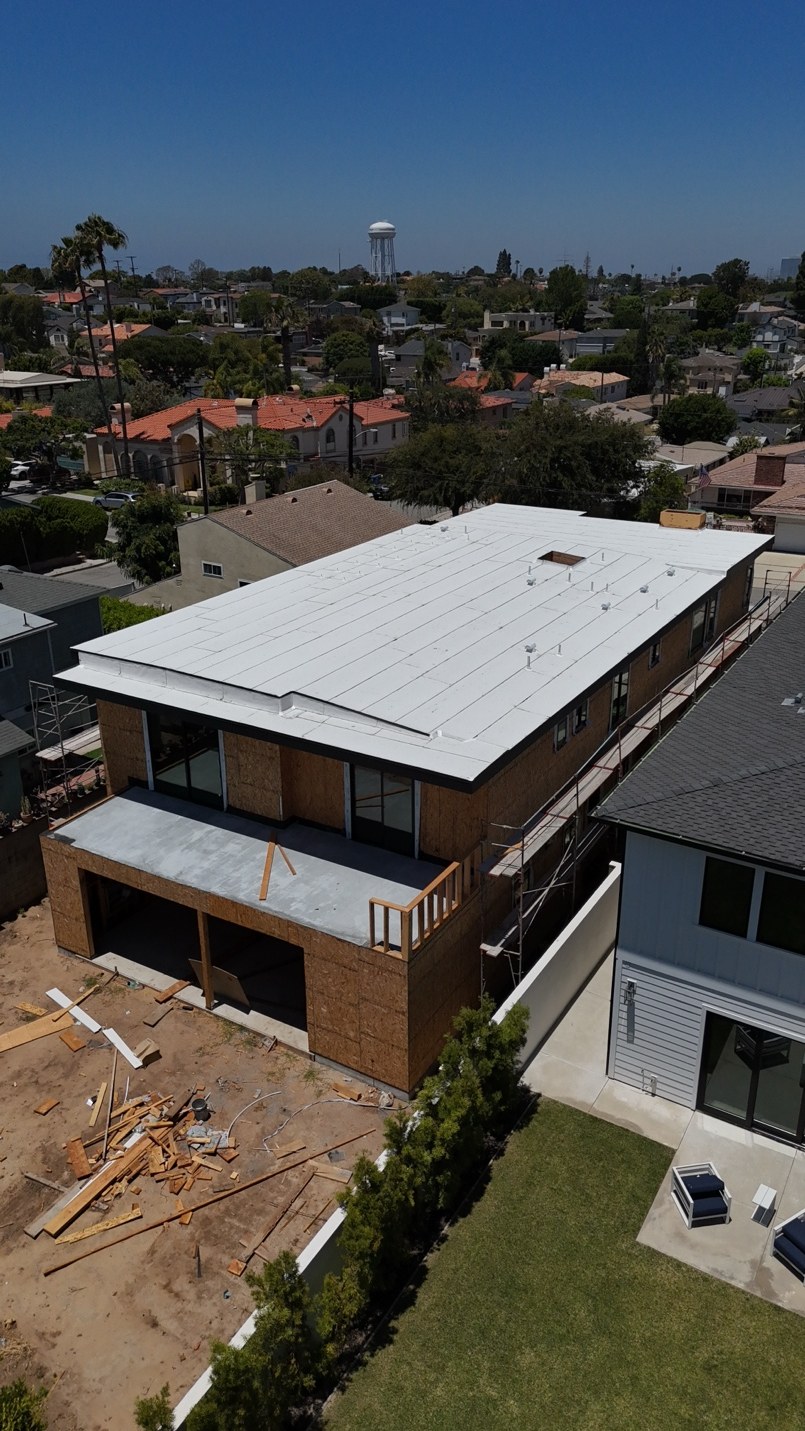 Aerial view of a new construction torch roof installation in Manhattan Beach