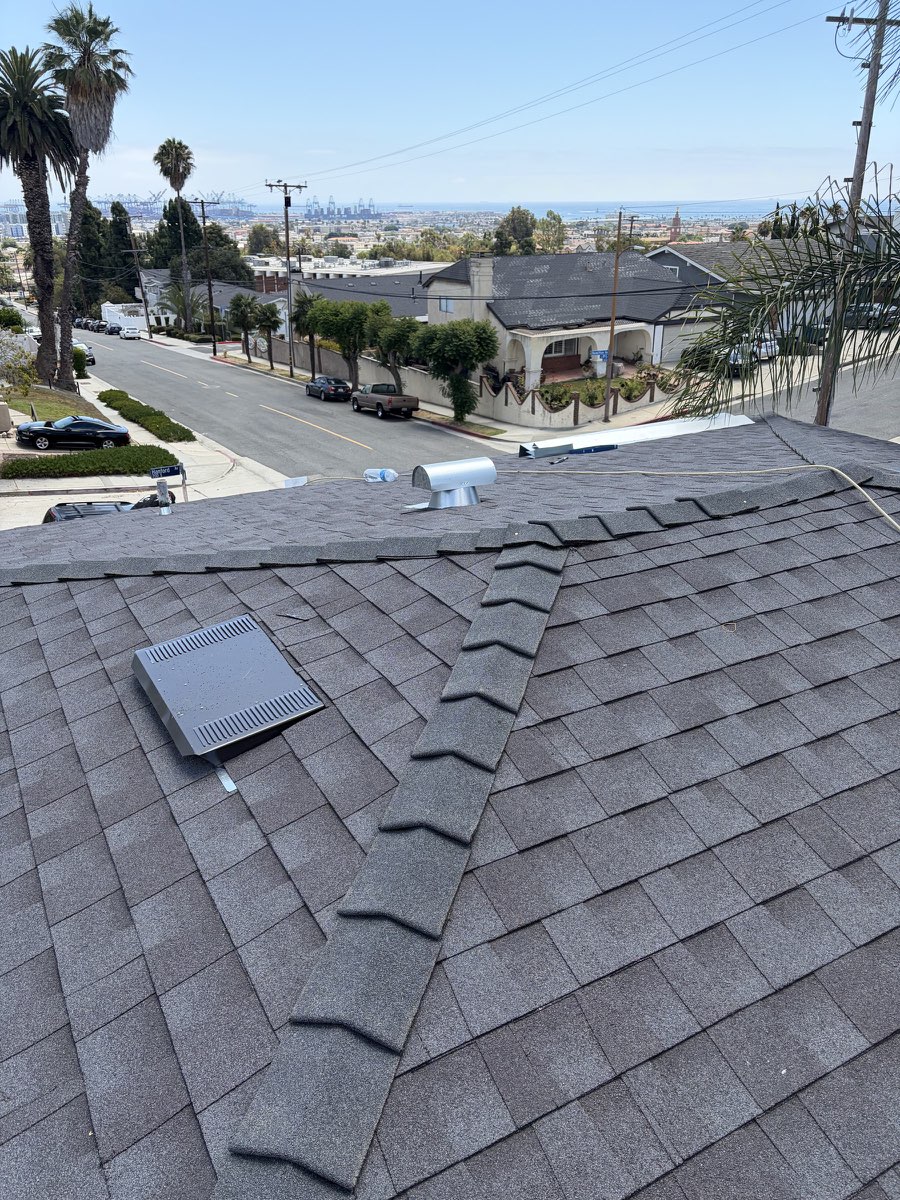 Finished shingle roof replacement on a home and detached garage overlooking San Pedro