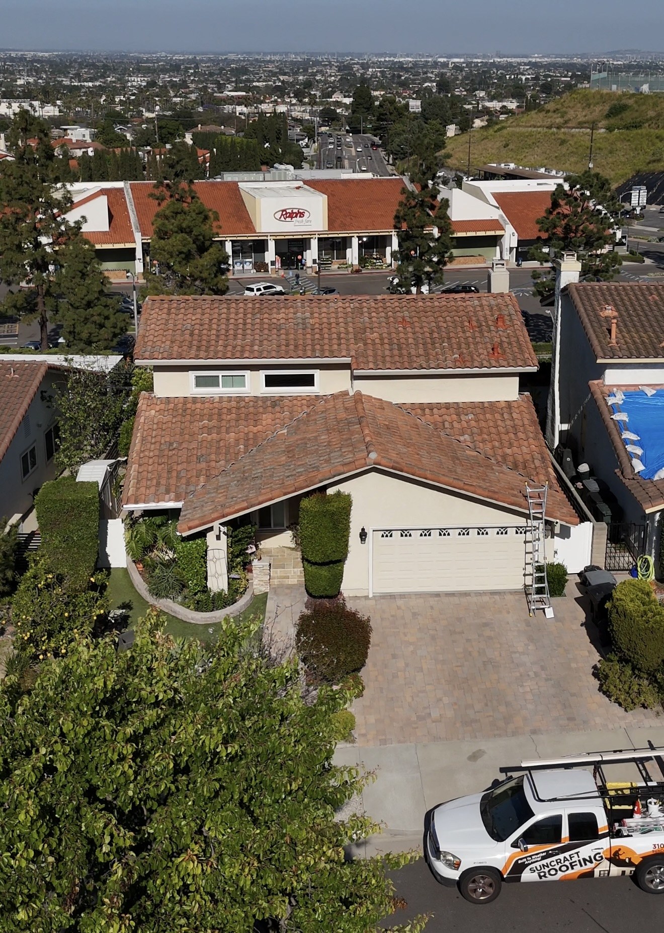 Aerial view of a tile roof re-lay on a house in Torrance