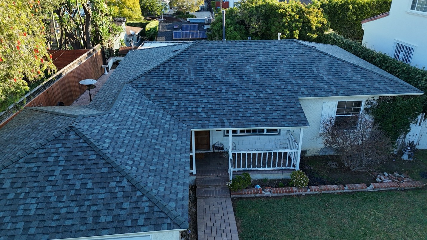 Aerial view of a shingle roof replacement on a home in Westchester