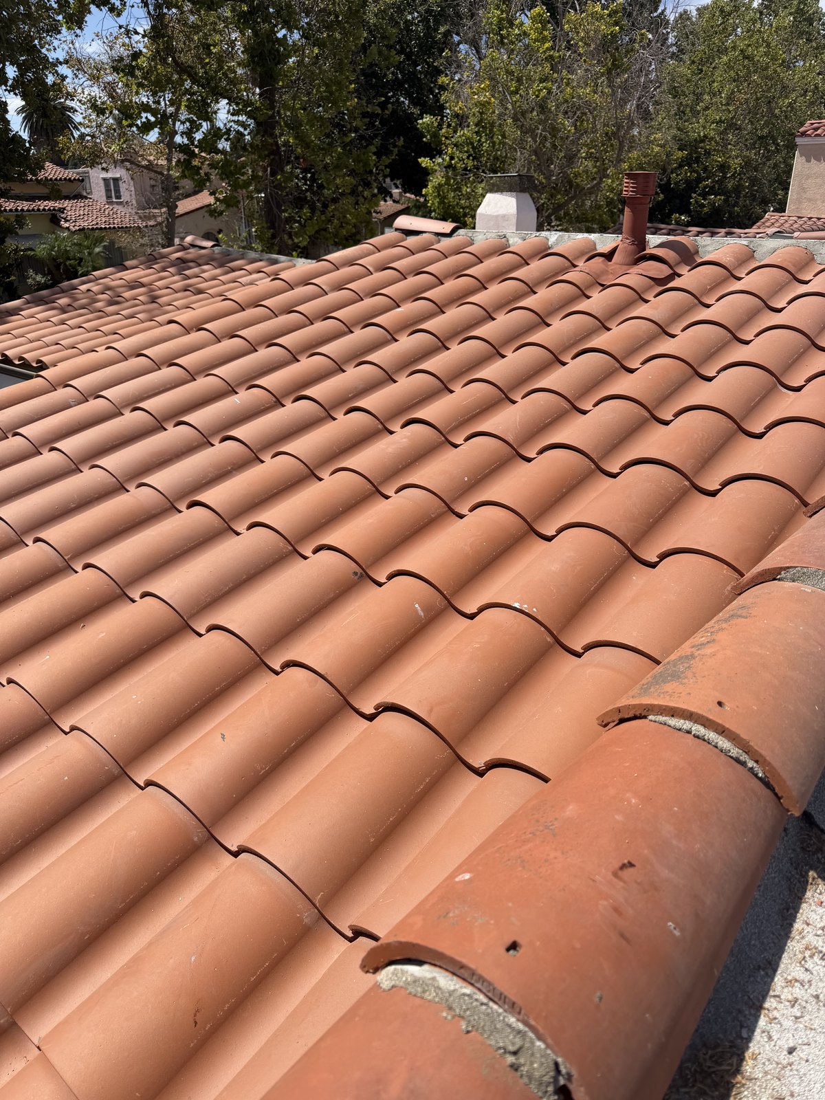Completed clay tile roof re-lay on a Los Angeles home paired with Perry's customer review