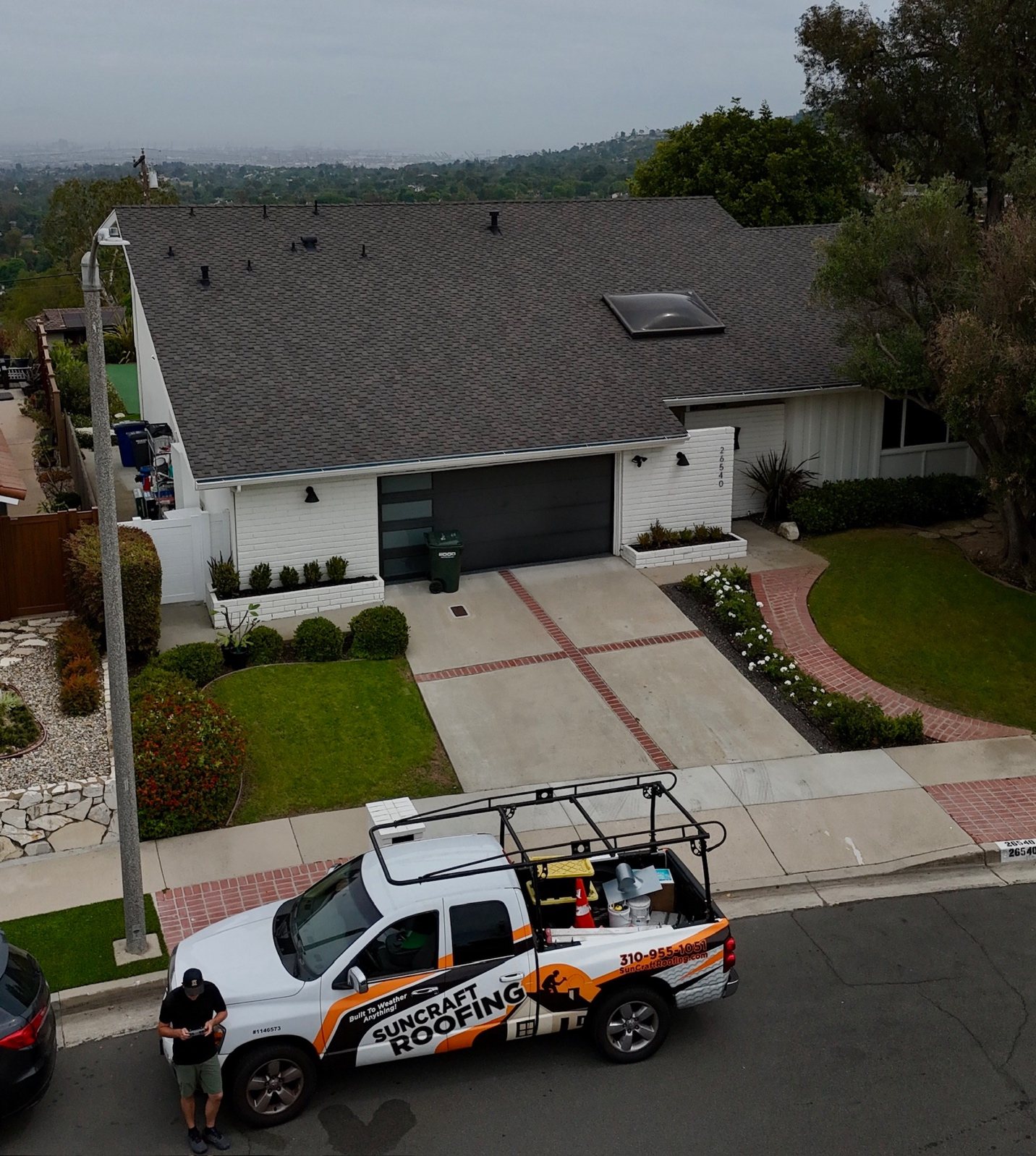 Suncraft Roofing project photo paired with Naomi C.'s customer review